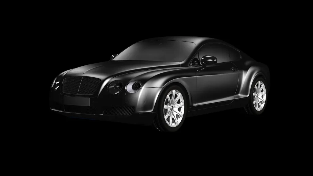 Black car hood with visible hard water spots beside a microfiber towel and spray bottle