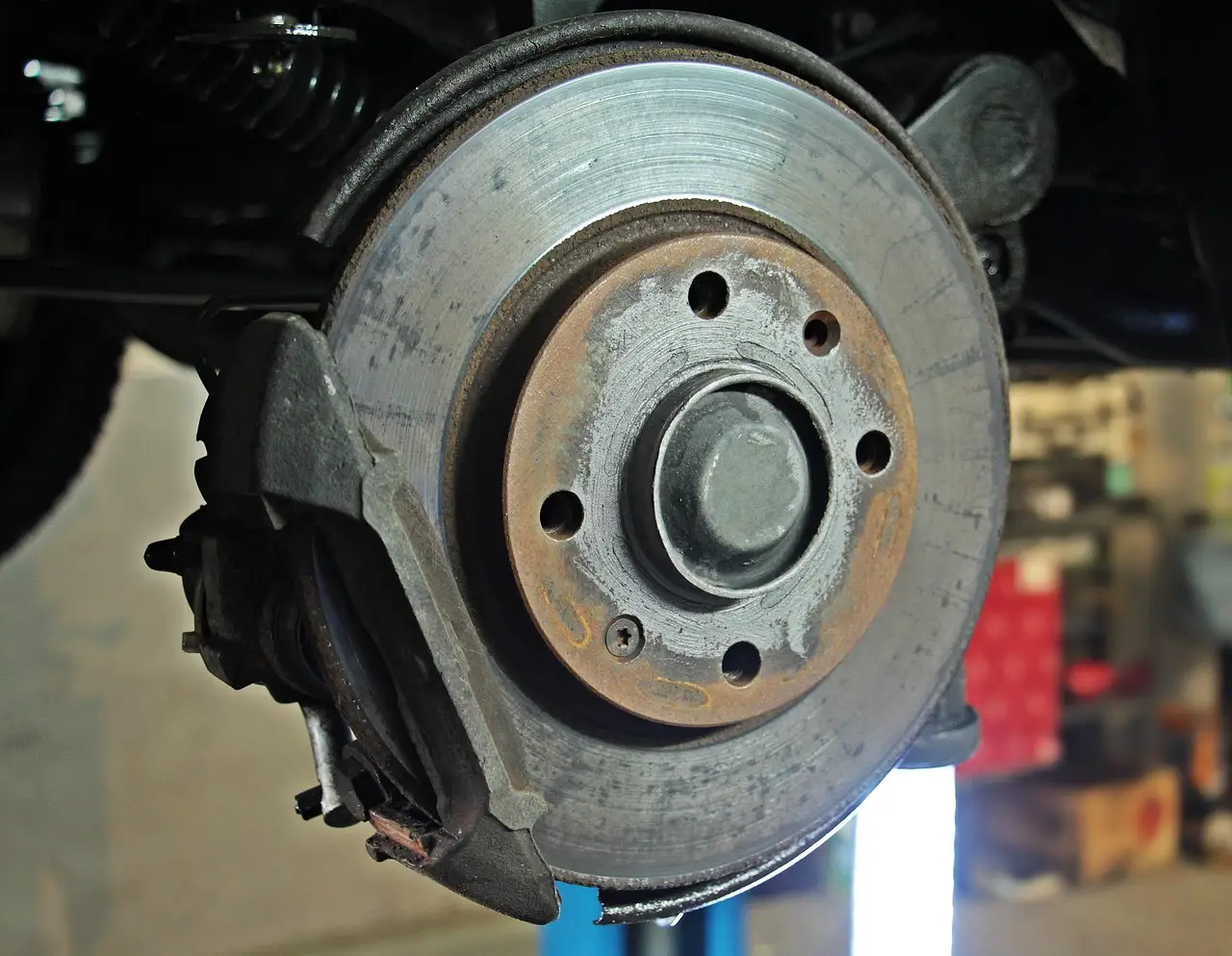 How do you check brake hardware during a pad change?
